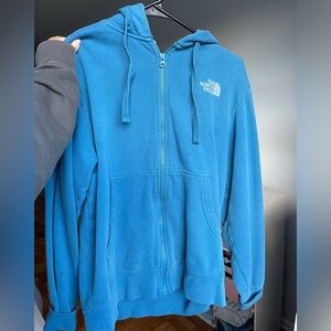Blue North Face zip up hoodie